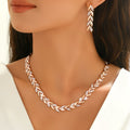 1 Bracelet and 1 Pair of Earrings