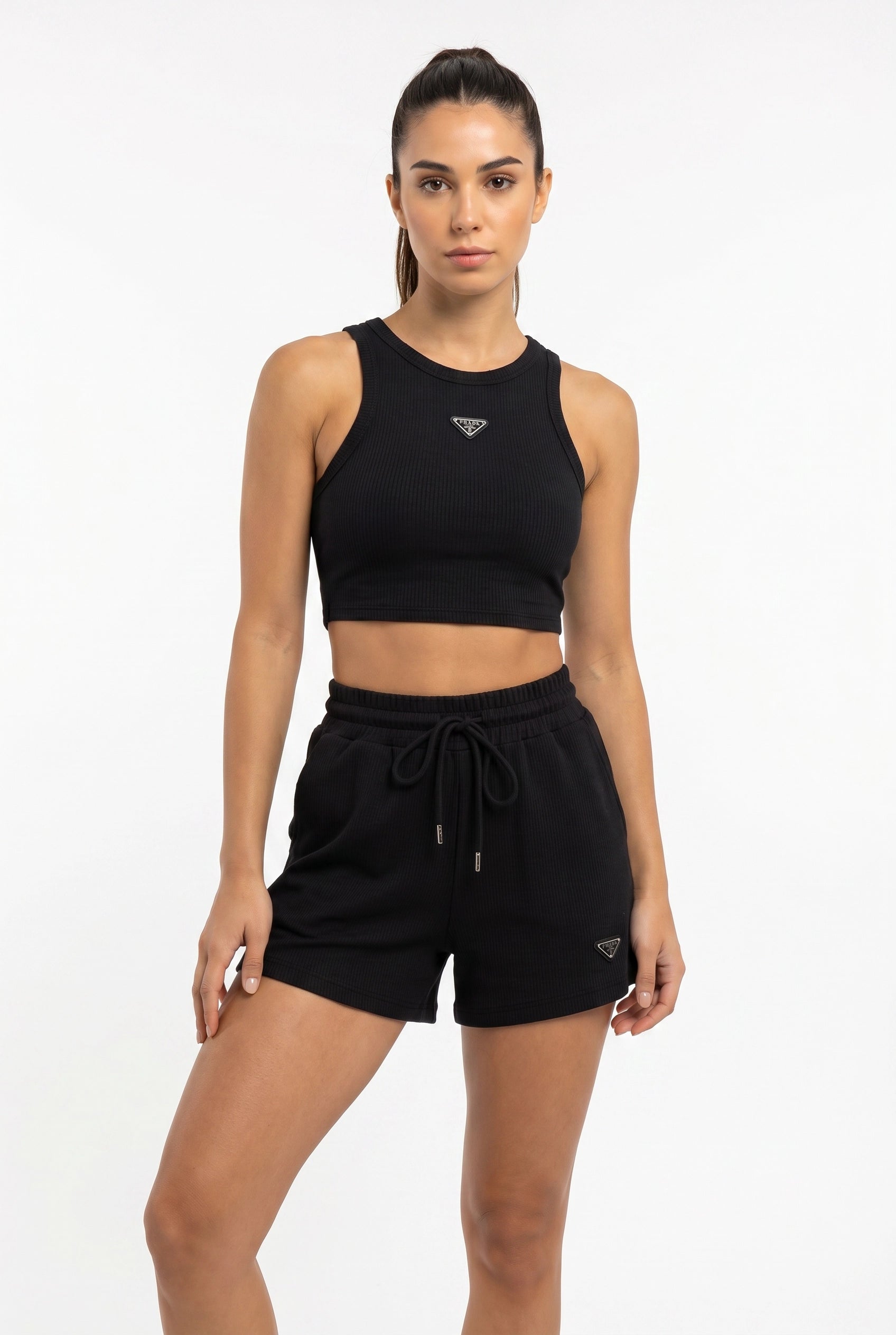 T_Alina wearing Sports Tracksuit Women in black, confident standing pose, white studio