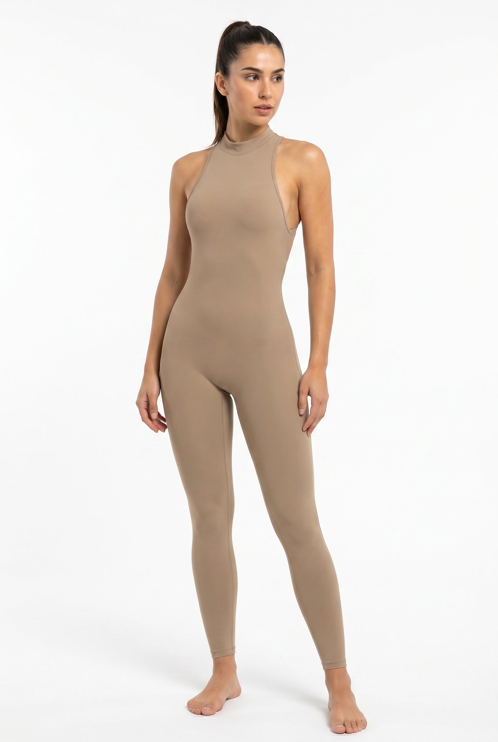 T_Alina wearing Sporty Jumpsuit in beige, full-length clean silhouette, white studio